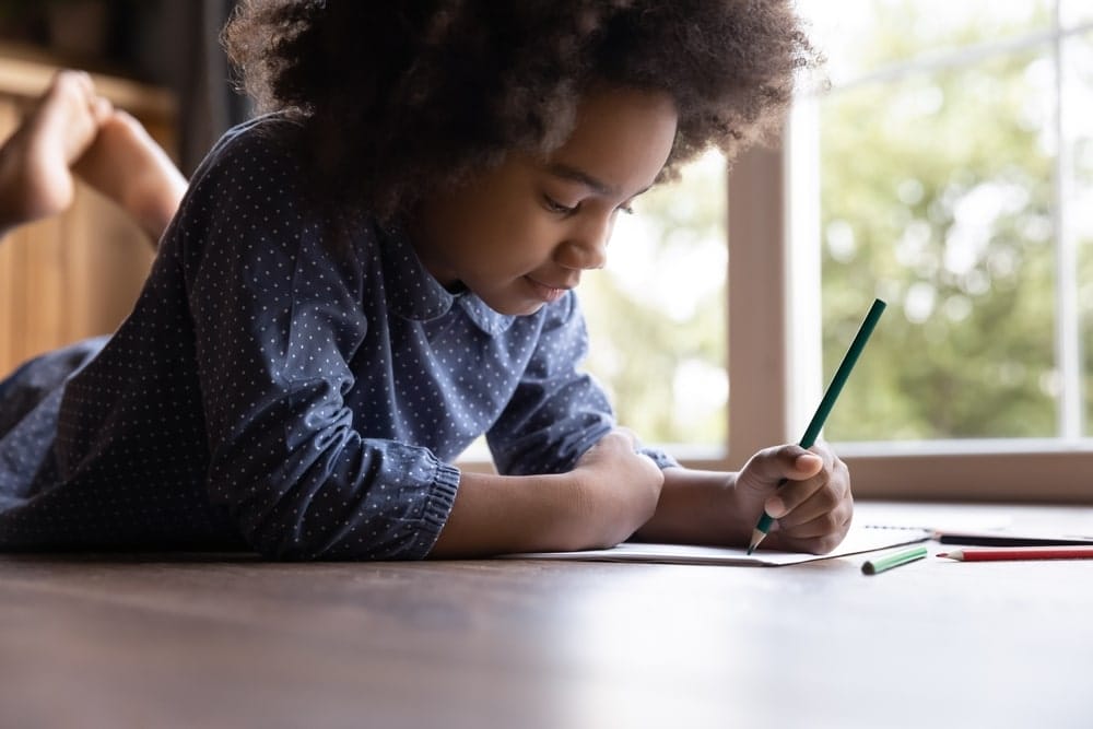 Child focused on drawing